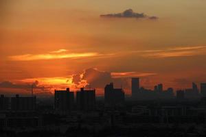 bight golden cloudy sky in sunset background in city building town photo