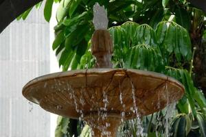 Urban ornamental water fountain in the city centre photo