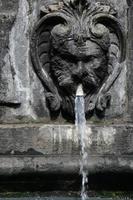 Urban ornamental water fountain in the city centre photo