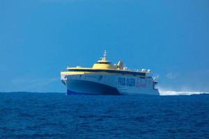 Ship sailing from the island of Tenerife to Agaete on the island of Gran Canaria photo