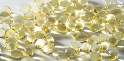 Vitamin D, omega 3, omega 6, Food supplement oil filled fish oil, vitamin A, vitamin E, flaxseed oil. photo