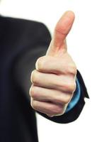 Business man hand with thumb up photo