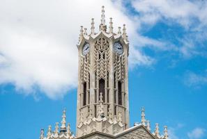 The clock tower of an Old arts building in the University of Auckland is the largest university in New Zealand.