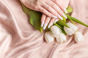 Female hand with spring nail design. photo