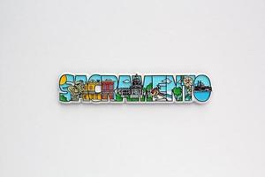 Colourful PVC souvenir fridge magnet of Sacramento, USA on white background. Travel memory concept. Gift typical product for tourists from foreign trip. Home decoration. Top view, flat lay, close up photo