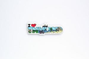 Colourful PVC souvenir fridge magnet of Thailand on white background. Travel memory concept. Gift typical product for tourists from foreign trip. Home decoration. Top view, flat lay, close up photo