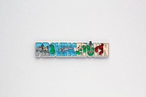 Colourful PVC souvenir fridge magnet of Provincetown, USA on white background. Travel memory concept. Gift typical product for tourists from foreign trip. Home decoration. Top view, flat lay, close up photo