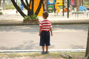 The boy was about to cross the road. photo