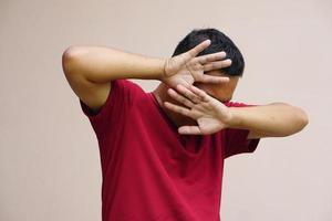 man raised her hand for dissuade, campaign stop violence against man. photo