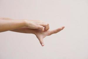 Asian woman having itchy skin on hands photo