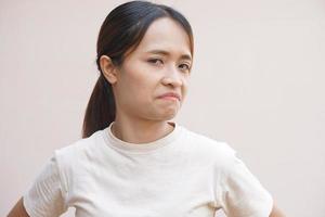 Asian woman making a dissatisfied face photo