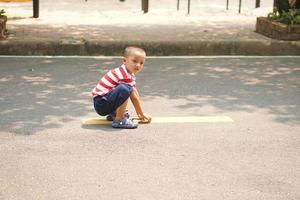 A boy running on the street in the park photo