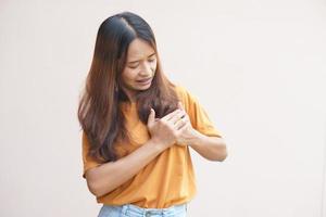 Asian woman having chest tightness photo