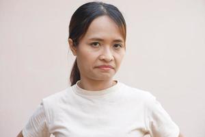 Asian woman making a dissatisfied face photo