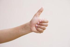 Asian woman doing her hand as a great sign photo