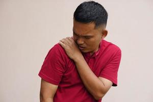 Asian man with shoulder pain photo