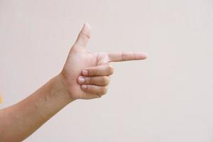 Asian woman pointing finger forward photo