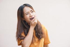 Asian woman having a toothache photo