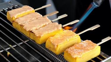 Close up gas burner cook the Tamago Mentaiyaki food video