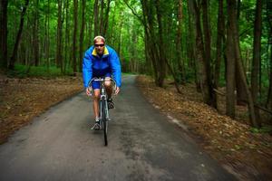 Man riding a bicycle outdoors photo