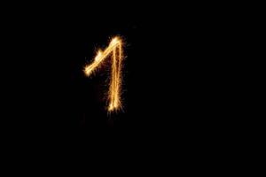 Number made with sparklers ready for your inscriptions on black background photo