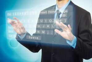 Businessman Hands pushing a button on a touch screen photo