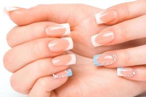 Beautiful female hands with french manicure photo