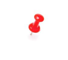 Red Push pin on white background photo