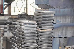 Sheets of metal and blanks in the workshop of a metallurgical plant or a metal working enterprise. photo