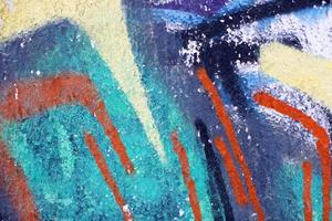 Part of abstract gravity multicolored with bright strokes. Painted concrete wall. photo