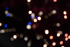 On a black background bokeh from explosions of colorful fireworks. photo