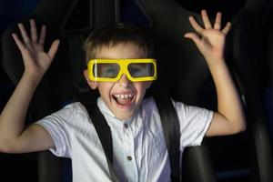 Happy child in glasses for 3d cinema. photo