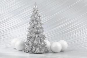 Christmas or New Year background with silver snowy tree and white transitional decoration. Bright festive background. photo