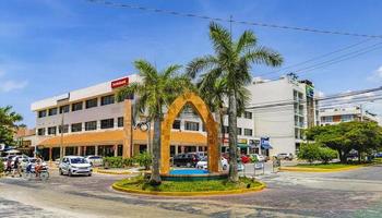 Playa del Carmen Quintana Roo Mexico 2022 Street with traffic circle and tropical palms Playa del Carmen. photo