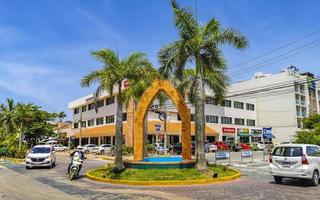 Playa del Carmen Quintana Roo Mexico 2022 Street with traffic circle and tropical palms Playa del Carmen. photo