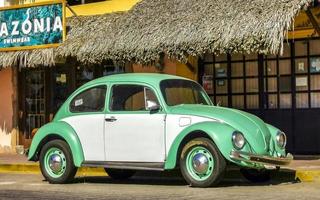 Puerto Escondido Oaxaca Mexico 2023 Turquoise tuned old classic vintage car cars Puerto Escondido Mexico. photo