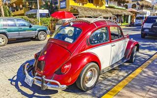 Puerto Escondido Oaxaca Mexico 2023 Red tuned old classic vintage car cars Puerto Escondido Mexico. photo