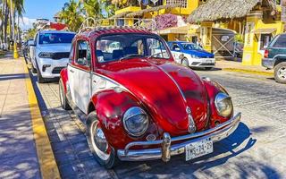 Puerto Escondido Oaxaca Mexico 2023 Red tuned old classic vintage car cars Puerto Escondido Mexico. photo