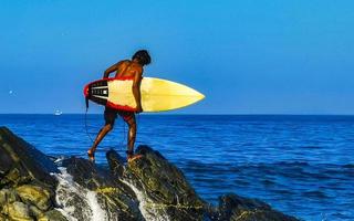 Puerto Escondido Oaxaca Mexico 2023 Surfer surfing on surfboard on high waves in Puerto Escondido Mexico. photo