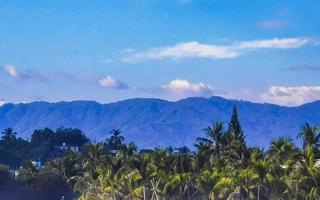 Mountain panorama cliffs rocks hilly tropical landscape Puerto Escondido Mexico. photo