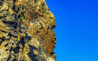 Mountain panorama cliffs rocks hilly tropical landscape Puerto Escondido Mexico. photo