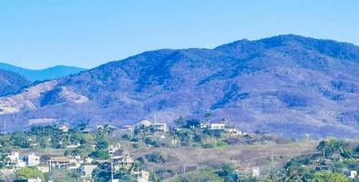 Mountain panorama cliffs rocks hilly tropical landscape Puerto Escondido Mexico. photo