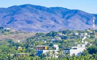 Mountain panorama cliffs rocks hilly tropical landscape Puerto Escondido Mexico. photo