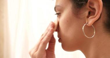 Woman In Front Of Mirror Applying Makeup video