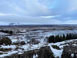 Icelandic landscape with fjord, lake and mountains in winter at Pingvellir National Park photo