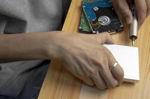 top view, man assembling an external hard drive photo