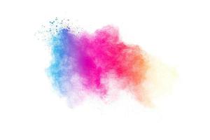 A splattered of pastel colored  powder on white background. Blue yellow pink particle textured background. photo