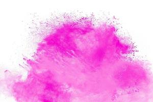 Pink dust particle splash on white background.Pink powder splash. photo