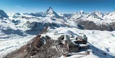 Aerial panorama view of the luxury hotel and the astronomic observatory at the Gornergrat photo