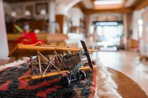 Propeller airplane figurine with textile decorated on table in hotel photo